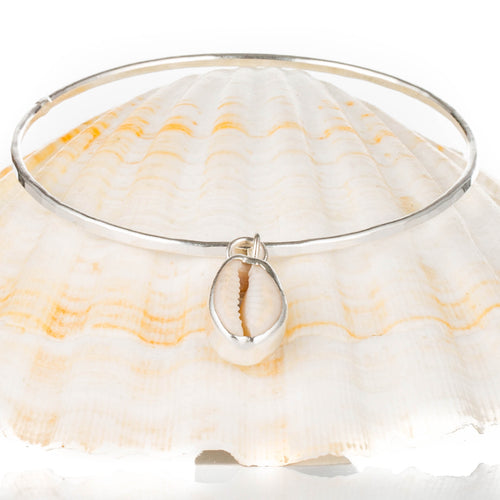 Cowrie Reef - A handmade hammered recycled sterling silver 925 bangle decorated with an upcycled cowrie shell.