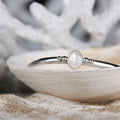 Free Mind - Saltwater Souls rainbow moonstone open bangle handcrafted with recycled sterling silver.