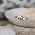 Hele Bay Silver Cowrie Ring - Saltwater Souls fine silver (.999) cast tiny cowrie shell found at Hele Bay, North Devon, on a hammered effect recycled sterling silver stacking ring.