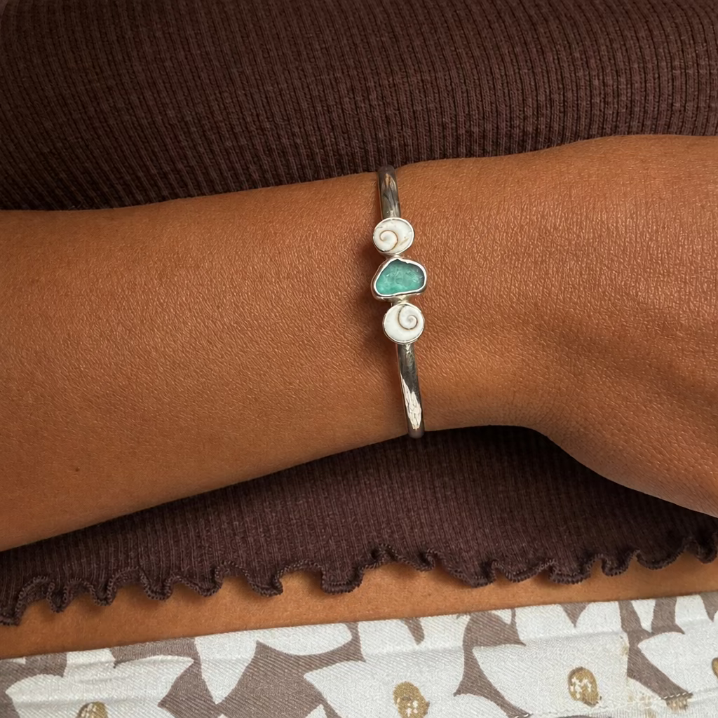 Undercurrent - Saltwater Souls sea glass and shiva shell recycled sterling silver open back bangle.