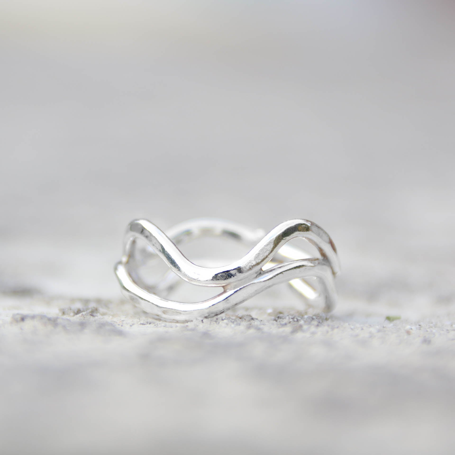 Left of the Stream - Saltwater Souls recycled sterling silver hammered effect swell lines stacking rings.