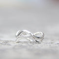Left of the Stream - Saltwater Souls recycled sterling silver hammered effect swell lines stacking rings.