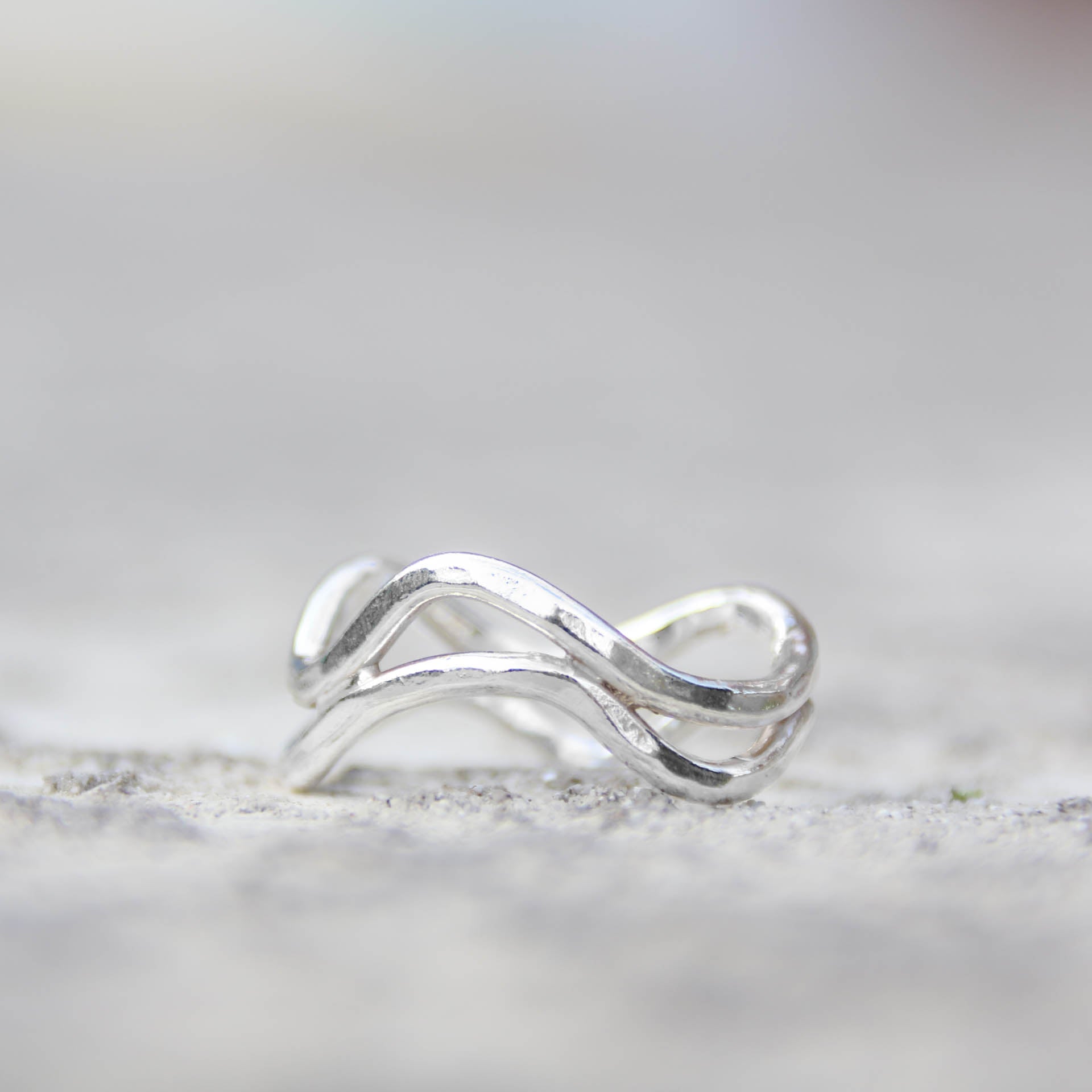 Left of the Stream - Saltwater Souls recycled sterling silver hammered effect swell lines stacking rings.