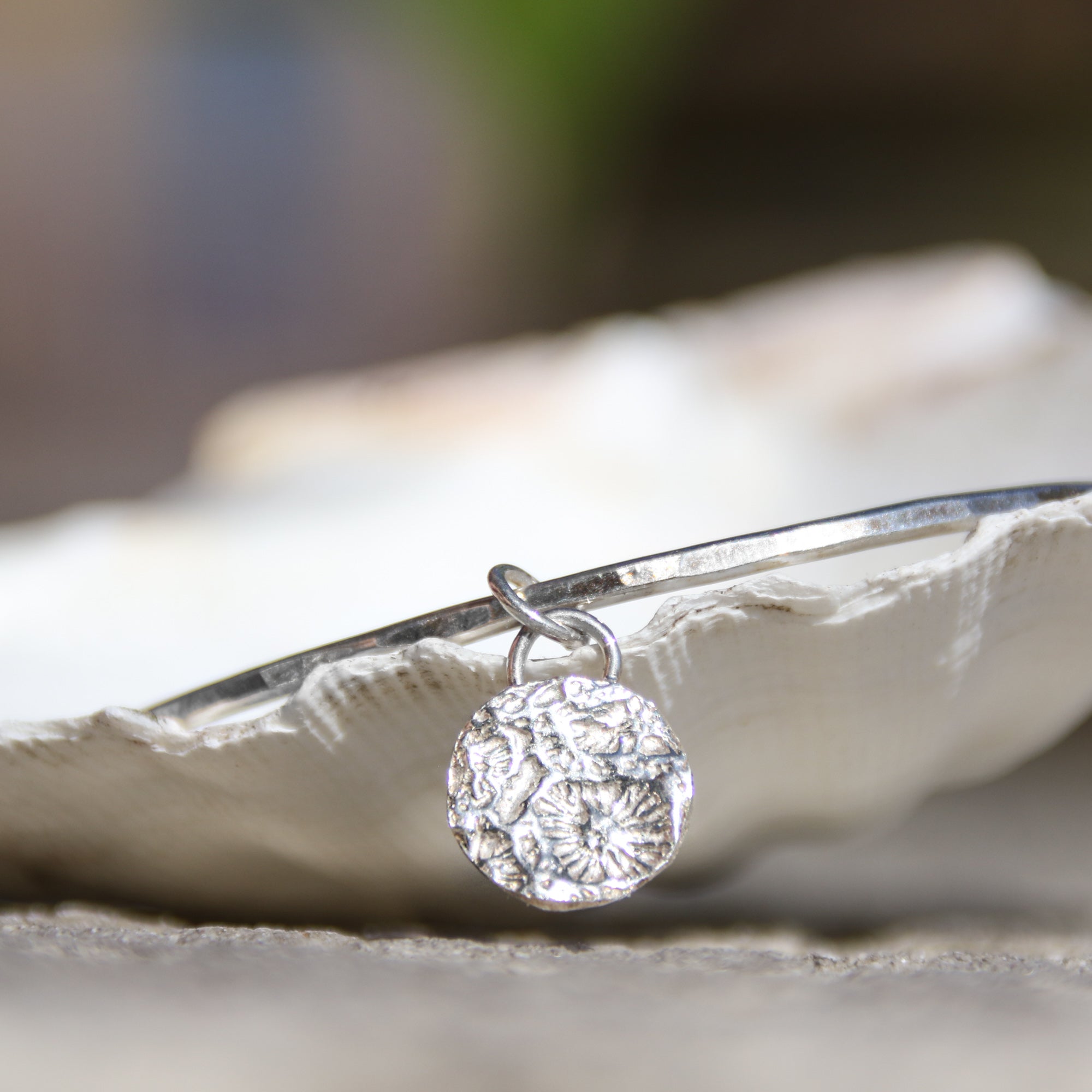 Little Coral Bangle - Saltwater Souls fine silver (.999) cast coral texture charm on a hammered recycled sterling silver bangle.