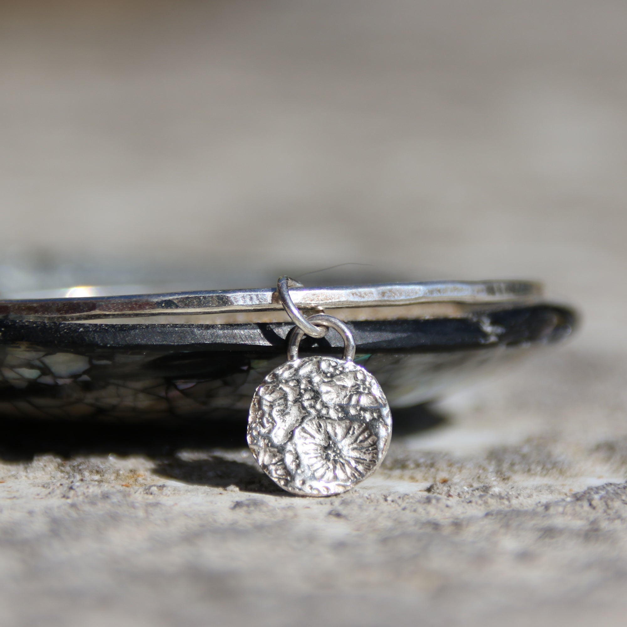 Little Coral Bangle - Saltwater Souls fine silver (.999) cast coral texture charm on a hammered recycled sterling silver bangle.