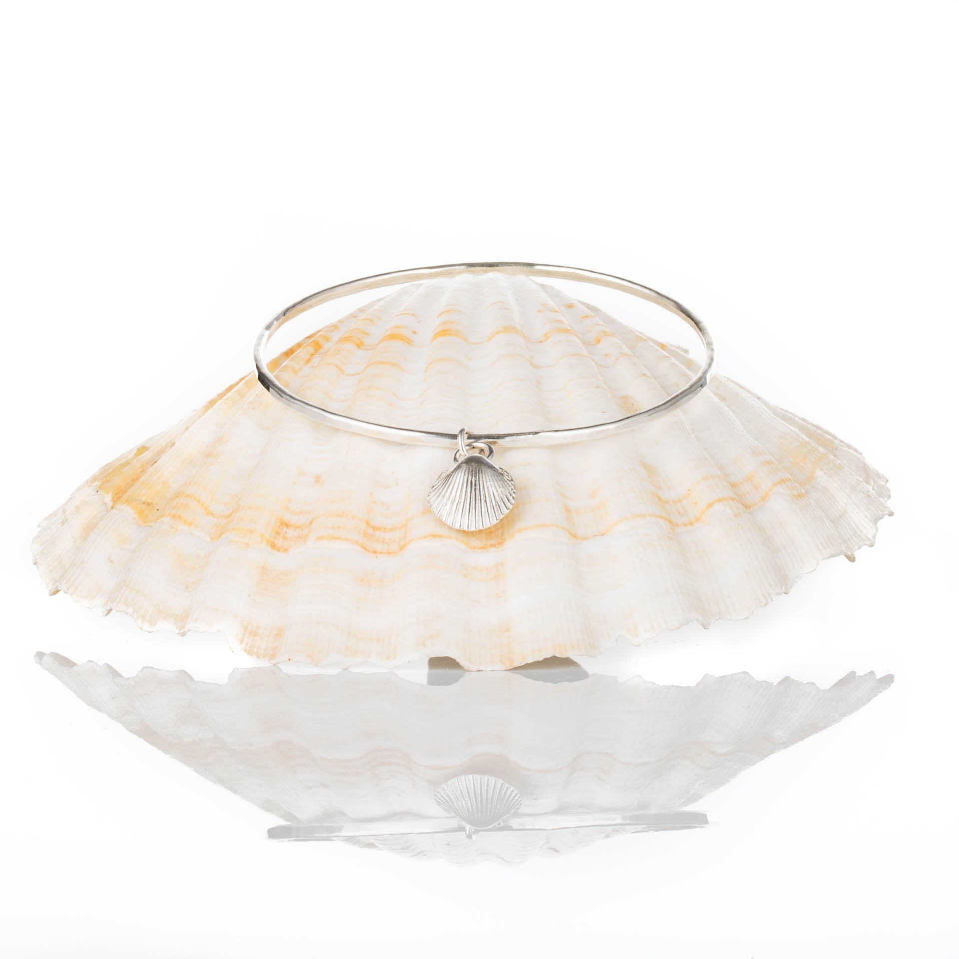 Mermaid's Song Bangle - Saltwater Souls fine silver (.999) cast cockle shell charm on a hammered effect recycled sterling silver bangle.