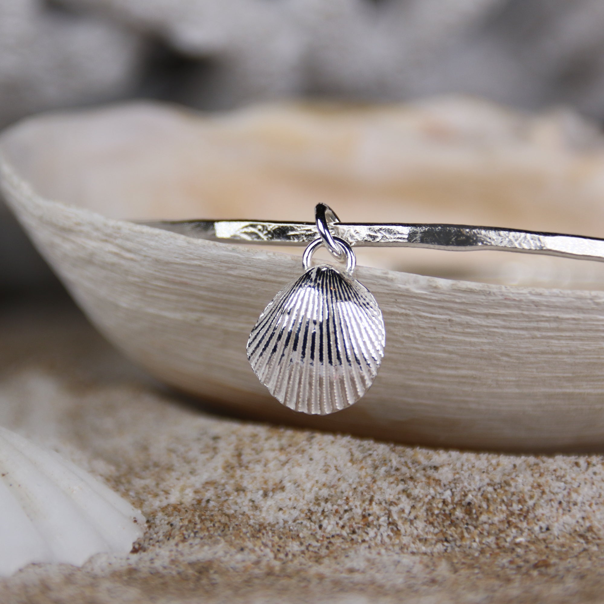 Mermaid's Song Bangle - Saltwater Souls fine silver (.999) cast cockle shell charm on a hammered effect recycled sterling silver bangle.