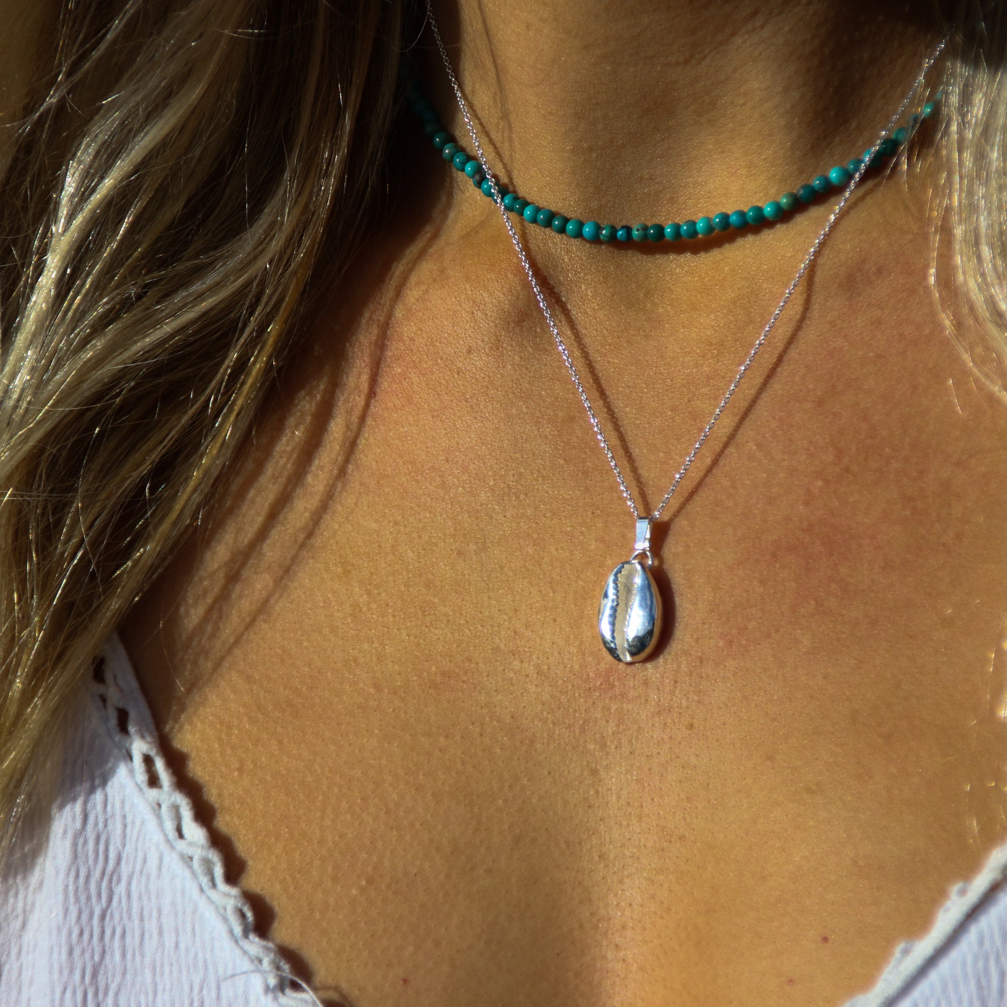 Silver Cowrie - Saltwater Souls fine silver (.999) cowrie shell cast on a sterling silver chain.