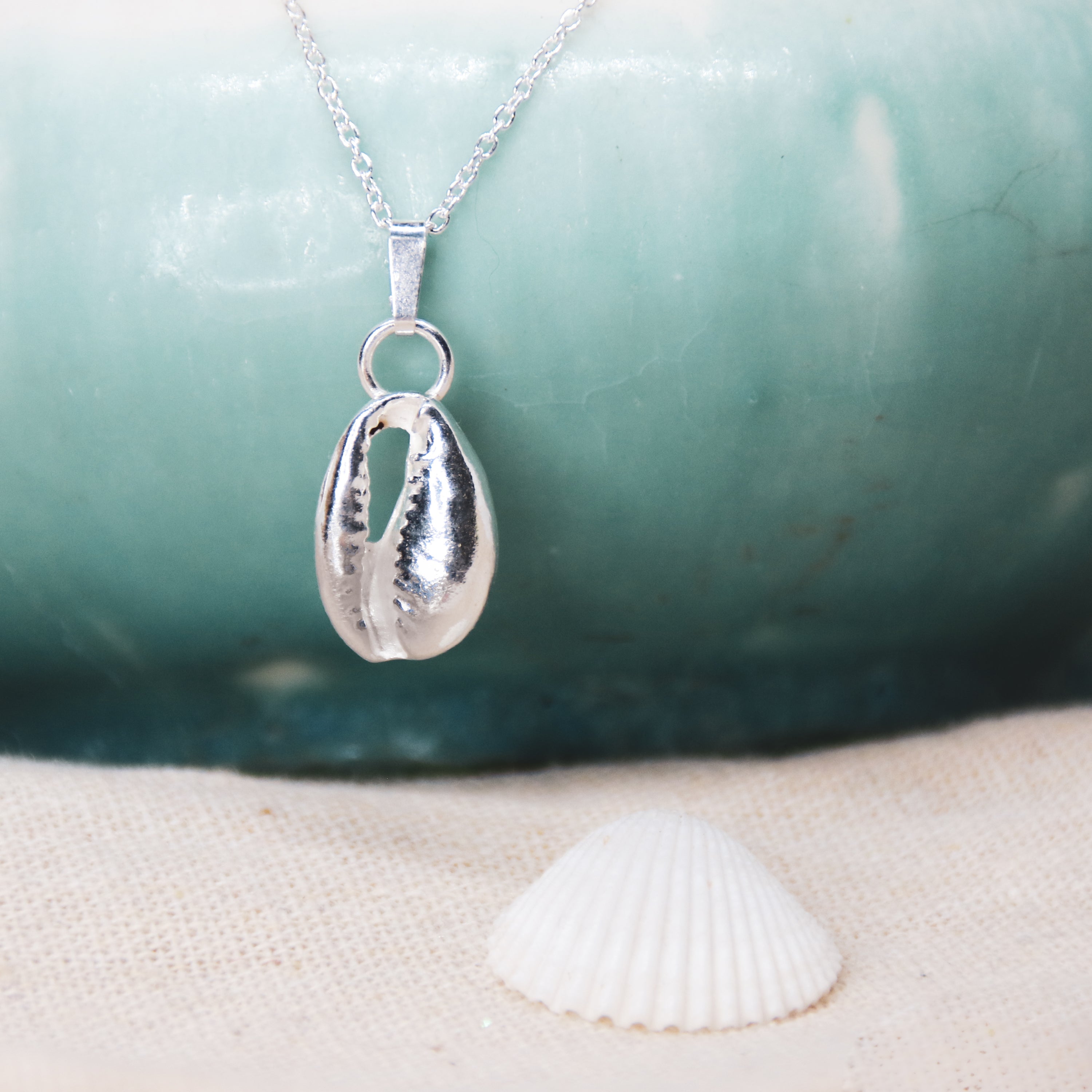 Silver Cowrie - Saltwater Souls fine silver (.999) cowrie shell cast on a sterling silver chain.