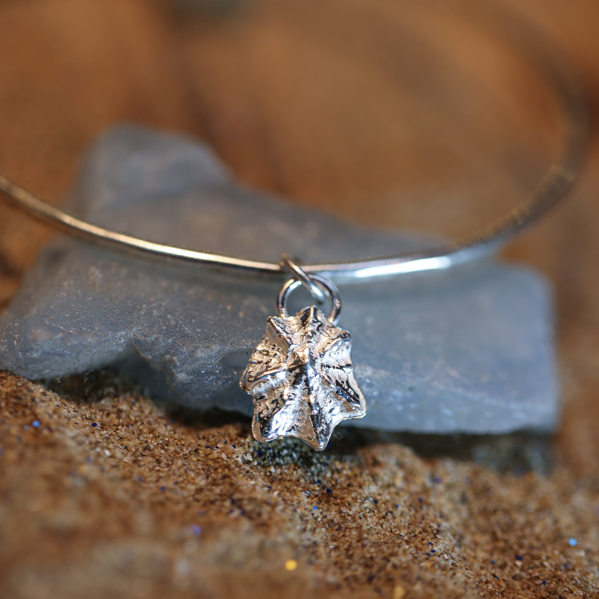 Silver Limpet Bangle - Saltwater Souls fine silver (.999) cast limpet shell charm on a hammered effect recycled sterling silver bangle.