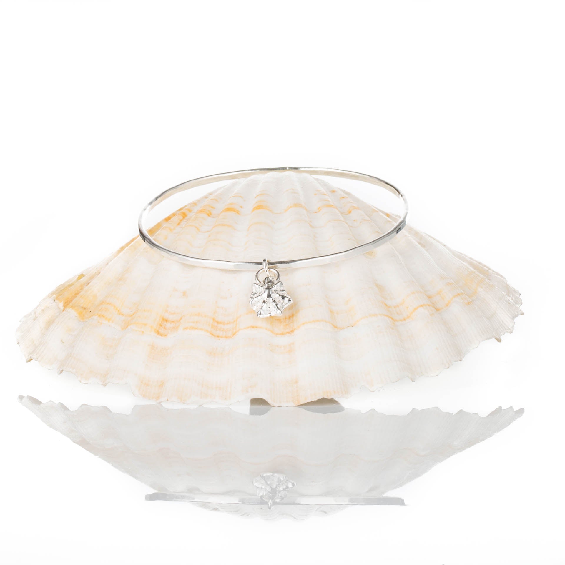 Silver Limpet Bangle - Saltwater Souls fine silver (.999) cast limpet shell charm on a hammered effect recycled sterling silver bangle.