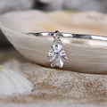 Silver Limpet Bangle - Saltwater Souls fine silver (.999) cast limpet shell charm on a hammered effect recycled sterling silver bangle.