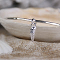 Tide Line Bangle - Saltwater Souls fine silver (.999) cast auger shell charm on a hammered effect recycled sterling silver bangle.