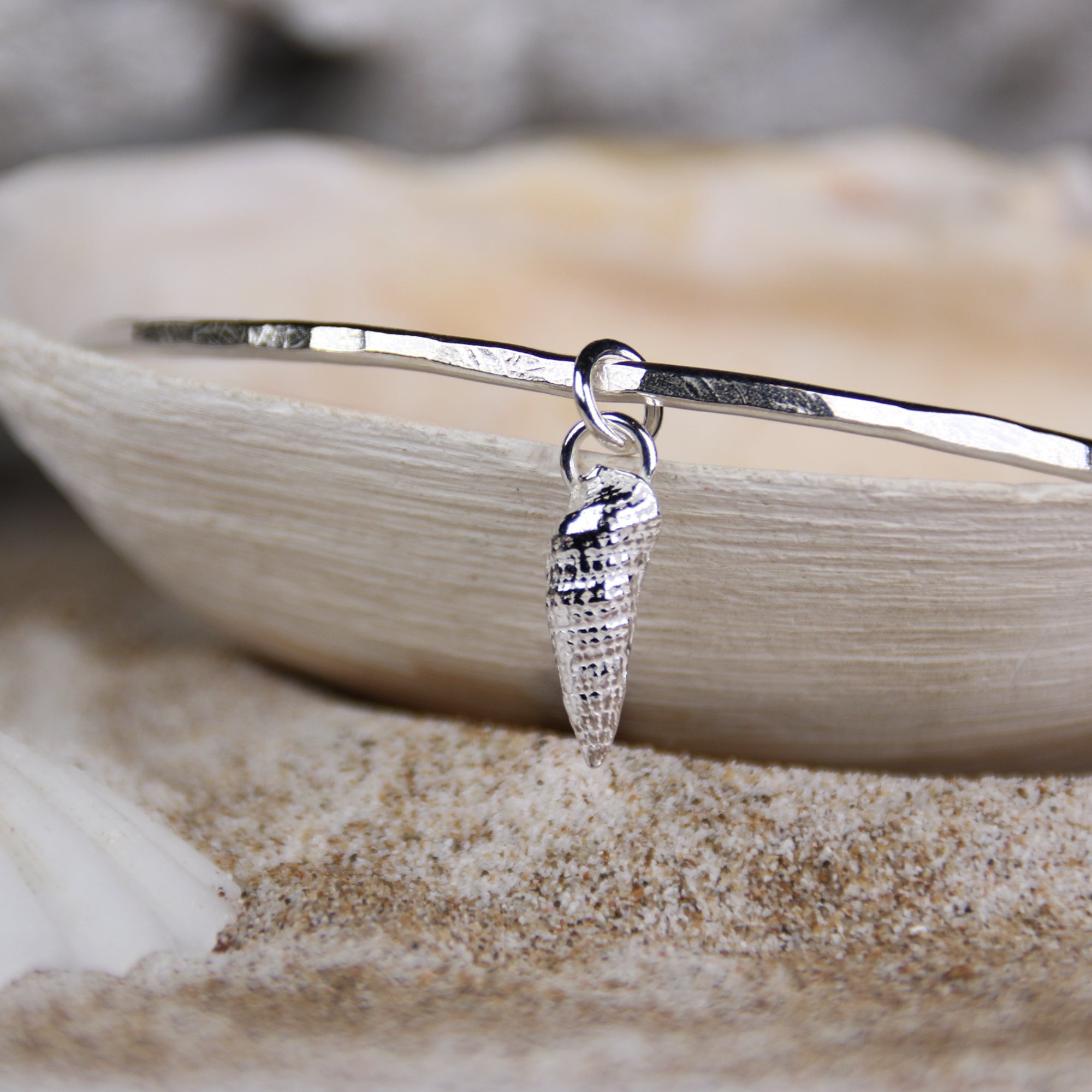 Tide Line Bangle - Saltwater Souls fine silver (.999) cast auger shell charm on a hammered effect recycled sterling silver bangle.