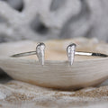 Tidal Pull - Saltwater Souls fine silver (.999) cast auger shells on a hammered effect recycled sterling silver open bangle.