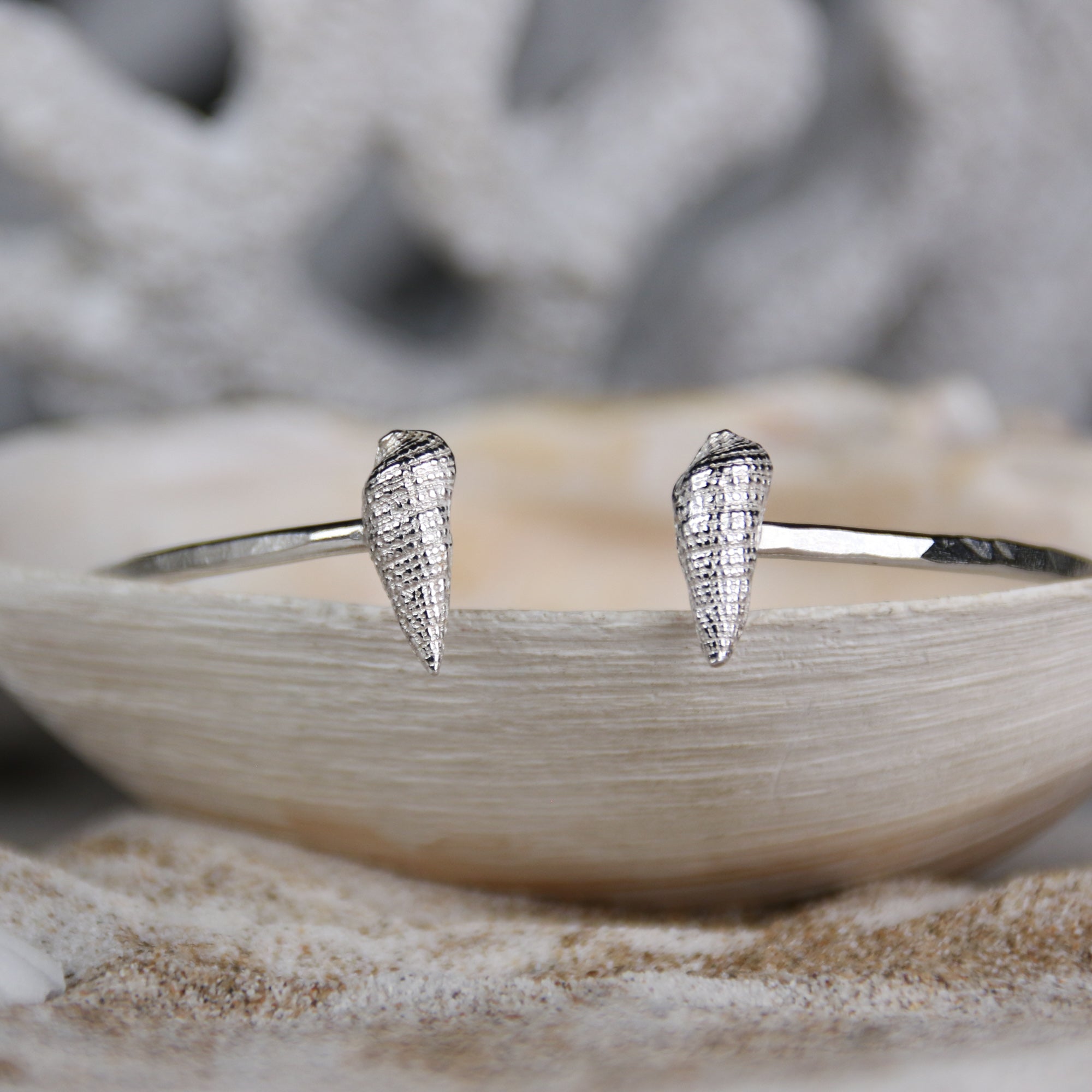 Tidal Pull - Saltwater Souls fine silver (.999) cast auger shells on a hammered effect recycled sterling silver open bangle.