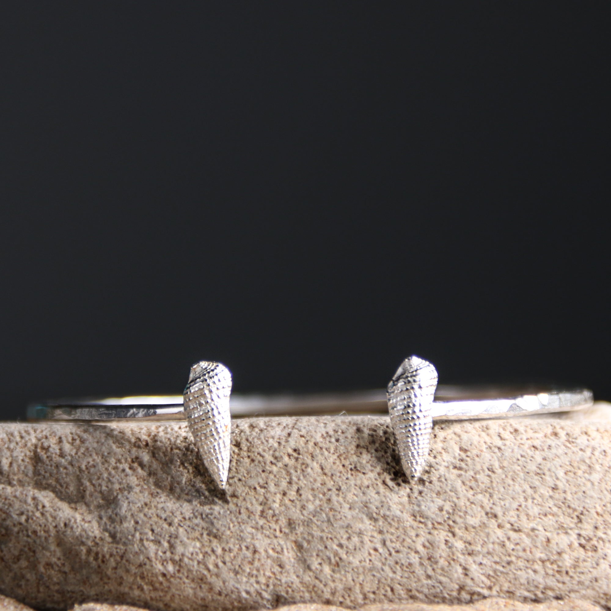 Tidal Pull - Saltwater Souls fine silver (.999) cast auger shells on a hammered effect recycled sterling silver open bangle.