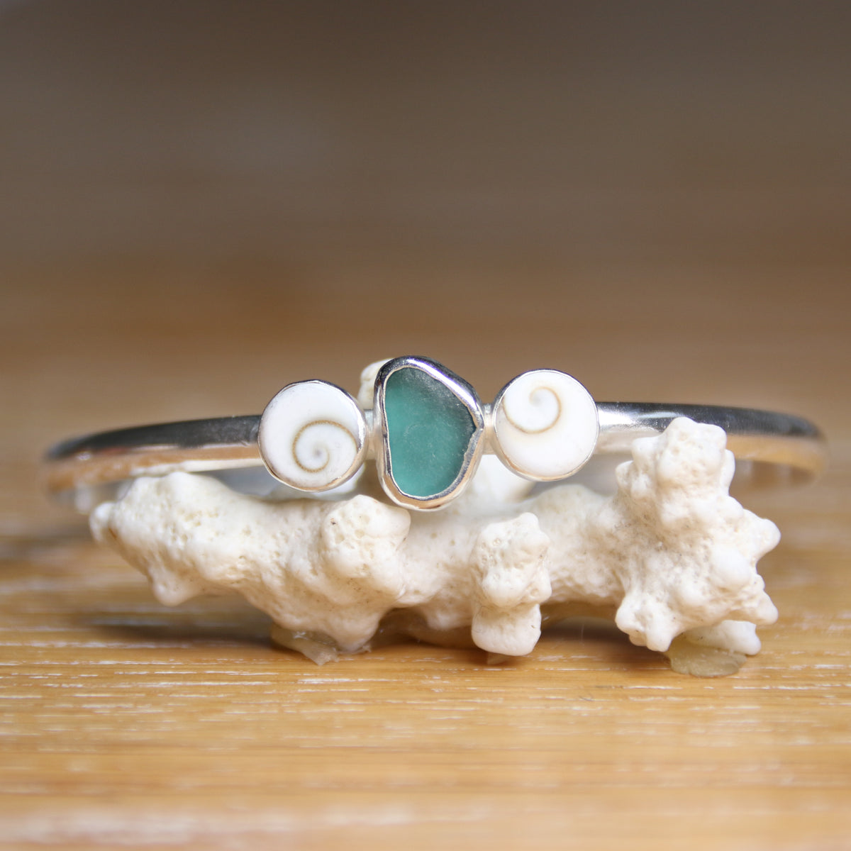 Undercurrent - Saltwater Souls sea glass and shiva shell recycled sterling silver open back bangle.