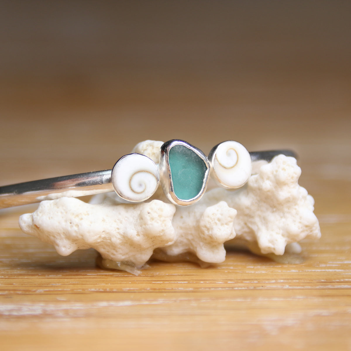 Undercurrent - Saltwater Souls sea glass and shiva shell recycled sterling silver open back bangle.