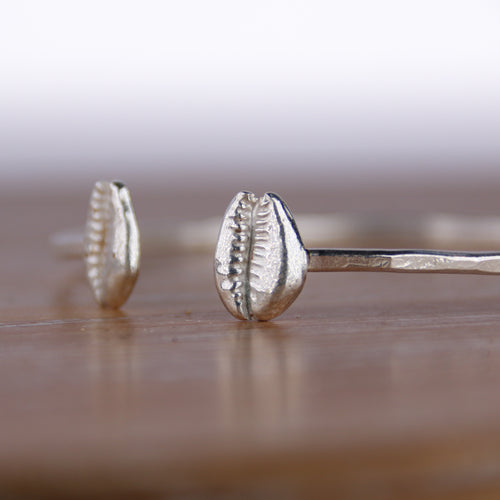 Beach Days - Saltwater Souls fine silver (.999) cast cowrie shells on a hammered effect recycled sterling silver open bangle.
