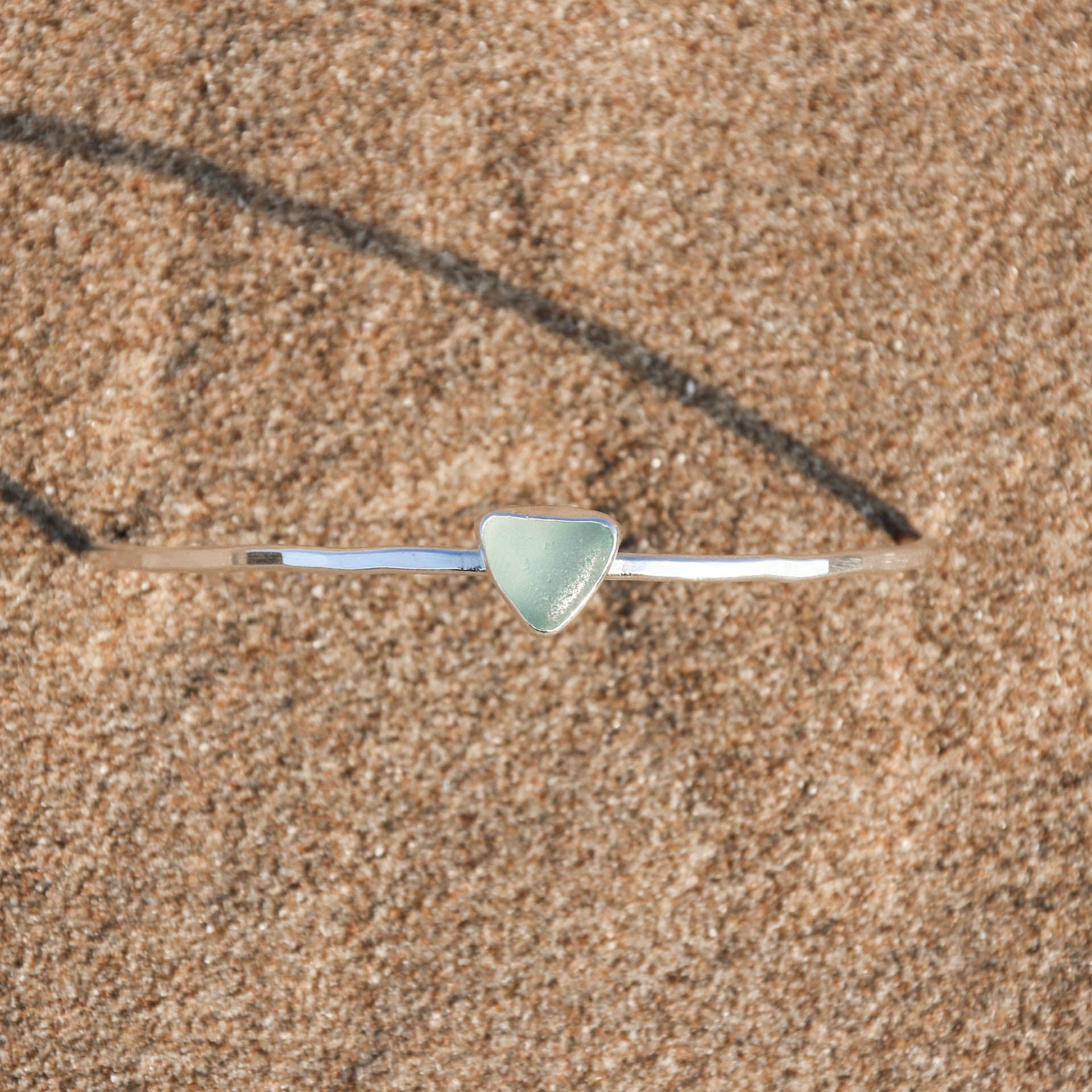 Blue Tides - Saltwater Souls sea glass hammered effect bangle, handcrafted with recycled sterling silver.
