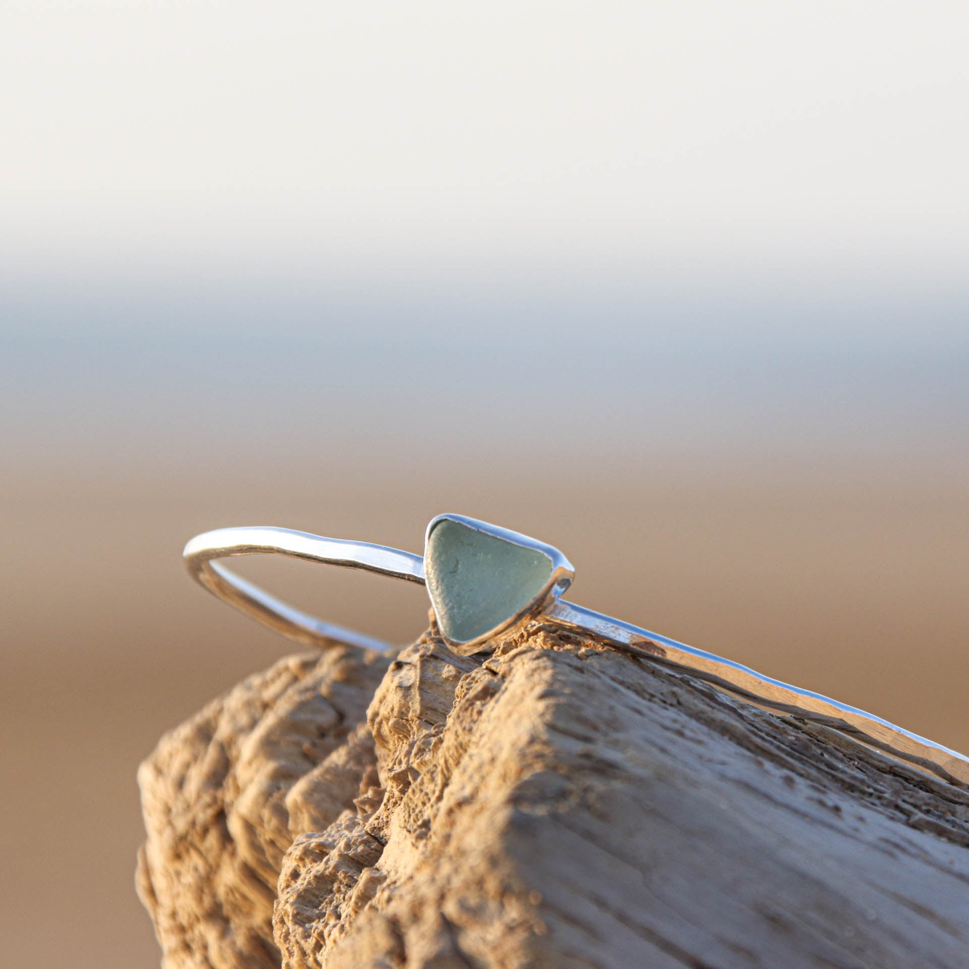 Blue Tides - Saltwater Souls sea glass hammered effect bangle, handcrafted with recycled sterling silver.