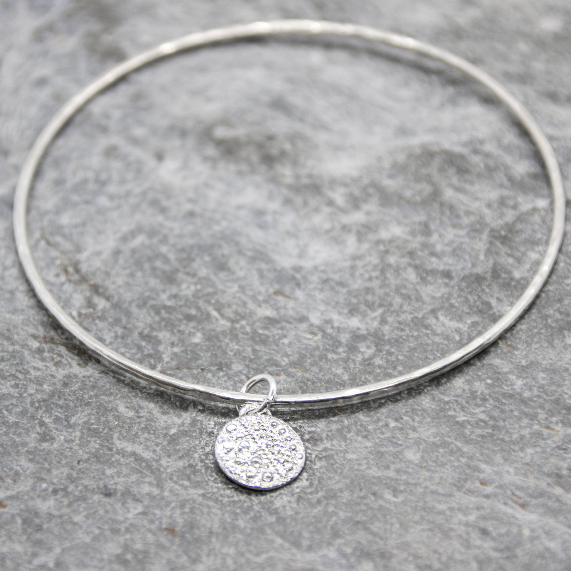 Little Urchin Bangle - Saltwater Souls fine silver (.999) cast urchin shell texture charm on a hammered recycled sterling silver bangle.