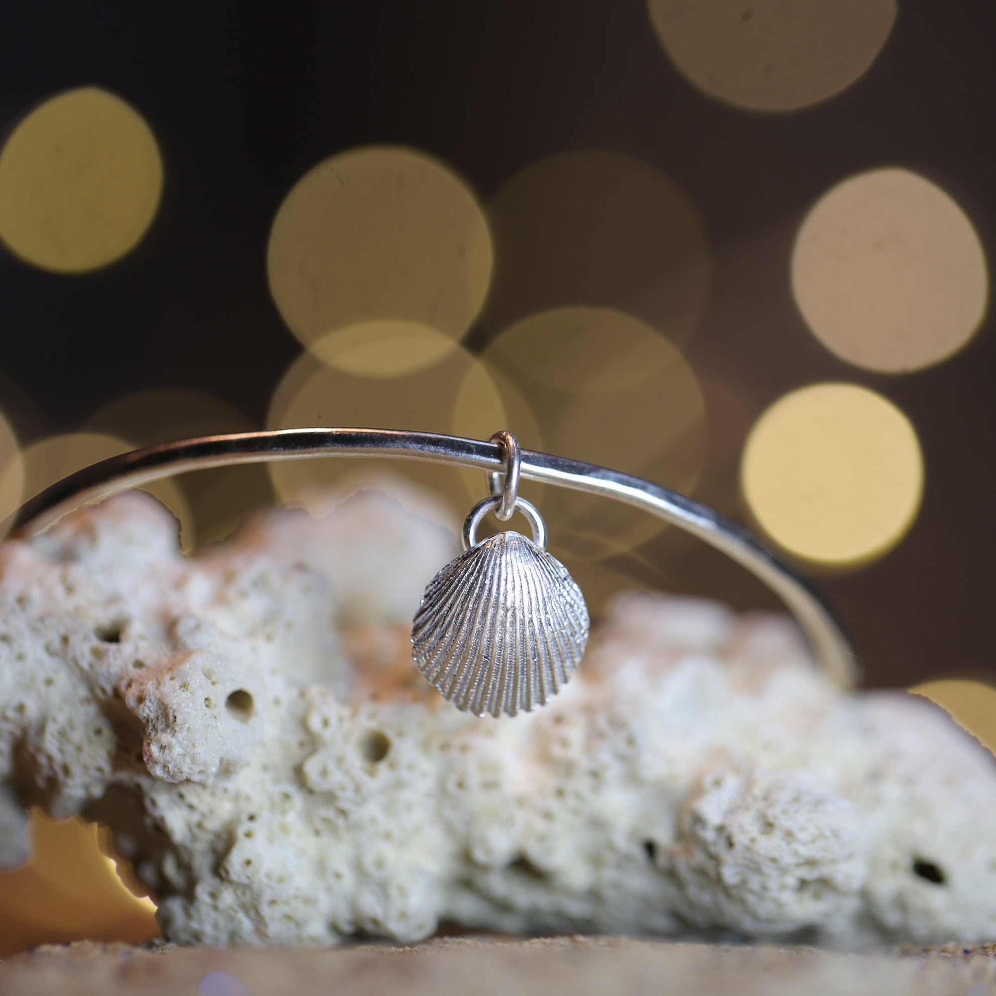 Mermaid's Song Bangle - Saltwater Souls fine silver (.999) cast cockle shell charm on a hammered effect recycled sterling silver bangle.