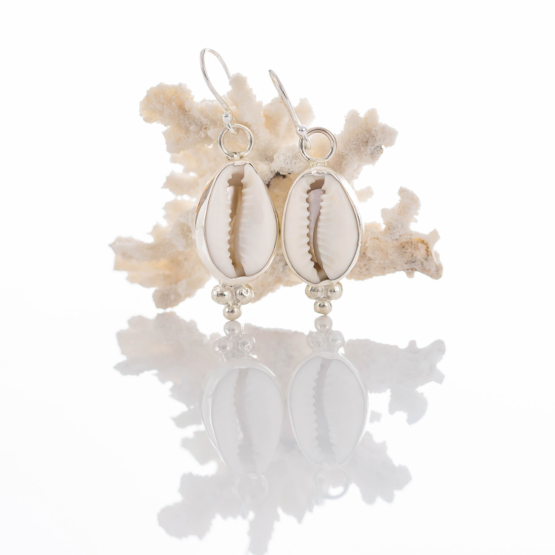 Sun Chaser - Saltwater Souls cowrie shell earrings handmade with upcycled shells and recycled eco sterling silver.